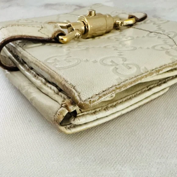 Gucci Guccissima Ivory Leather GG Logo BiFold Wallet, Gold Piston Closure